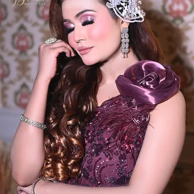 A beautiful purple-themed engagement or reception look. I teach how to use color in a sophisticated way, pairing a soft pink and purple eye with a matching lip and elegant hair accessory.