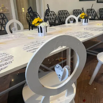 Every detail is designed with intention. For this music-themed party, even the chairs had a special touch, with hanging paper hearts made from musical sheets.