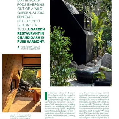An article feature showcasing the matte black pods emerging from the wild garden. The design is a conscious adaptation, creating a sanctuary that respects and enhances its natural surroundings.