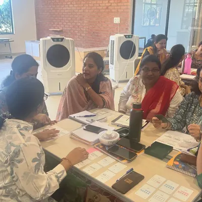 A moment of discovery during a professional development session with teachers. My goal is to create an environment where educators can experience the joy of hands-on learning themselves, so they can bring that same energy and understanding back to their students.