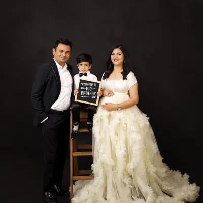 "Promoted to Big Brother!" We love including siblings in maternity shoots to celebrate the growing family. This family portrait is full of anticipation and joy.