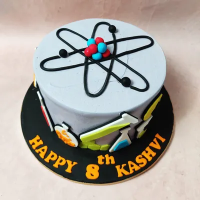 We make learning delicious with this creative science-themed cake. Featuring an atomic structure on top and beakers, flasks, and molecules around the side, this cake is the perfect formula for a budding scientist's birthday.