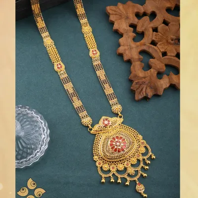 A classic gold mangalsutra with an ornate, oversized pendant. This is a staple in my collection, offering a traditional design with intricate detailing that is always in demand.