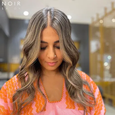 A Monday Makeover feature. This client is rocking a cool-toned balayage with beautiful ash and beige highlights that perfectly frame her face.