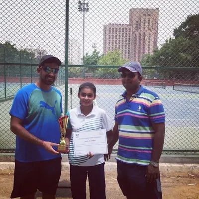 The winner of the Girls' Under 16 AITA Tournament receives her trophy and certificate. We are experienced in managing AITA events that contribute to the national ranking of junior players.