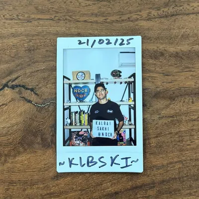A polaroid from a studio session. Holding up a sign for my crew NDCR, this is a snapshot of the behind-the-scenes work that goes into building a community and brand.