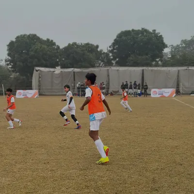 Our U-14 players in the midst of a competitive tournament match. The orange bibs show they are ready for action and working as a unit.