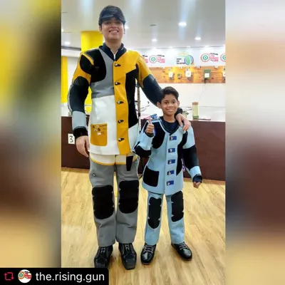 The journey to becoming a champion starts here. This picture of a seasoned competitive shooter with one of our aspiring young champions perfectly captures our mission to nurture future talent for the sport.