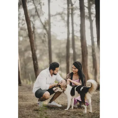 Including your furry friend in your pre-wedding shoot is a wonderful idea. It adds a personal and heartwarming touch to your story.