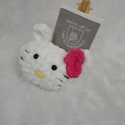 Here is a close-up of the finished Miss-Kitty amigurumi, a result of my beginner-friendly crochet kit. Notice the tight stitches and securely attached safety eyes, all made with the materials and instructions I provide.