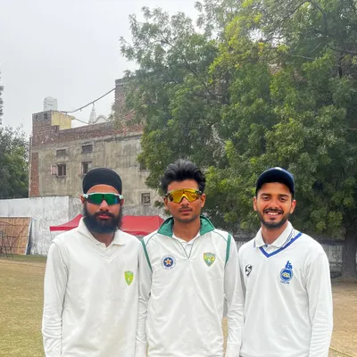 Three of our academy players, representing both Delhi Blues and Neo Sports clubs, stand together on the field. This showcases the pathway we provide for competitive cricket.