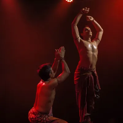 A powerful pose from 'ATAH' where Adithya PV and I move as one. The red lighting adds to the intensity and passion of the performance.