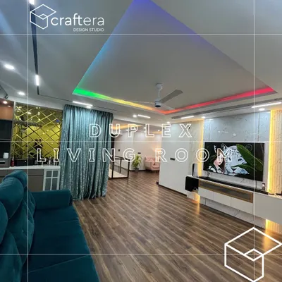 This is the living room of a duplex home I designed, featuring a spacious layout with modern furniture. I used recessed ceiling lights with customizable RGB colors to set different moods, from vibrant for parties to warm for quiet evenings.