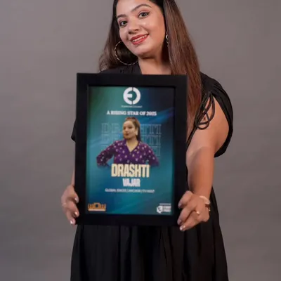 Holding my 'Rising Star of 2025' award from Entertainers Connect. This recognition is a proud milestone in my career as a global emcee and TV host.