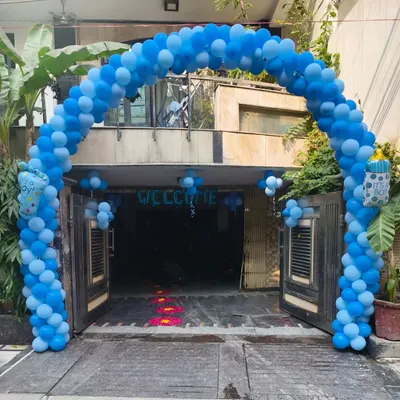 A grand balloon arch in shades of blue to welcome a baby boy home. I also added "It's a Boy" foil balloons to the entrance for a festive touch.