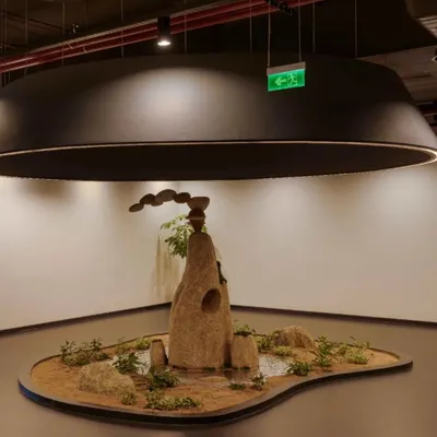 A wider view of the eco-friendly rock installation for My Home Group. The piece is designed to be a focal point in the corporate lobby, reflecting the brand's connection to nature and its solid, resilient foundation.