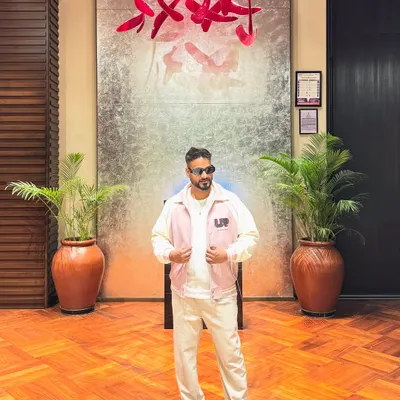 A confident pose in a stylish outfit. The look is an important part of the performance.