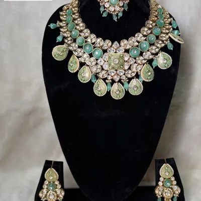This is my mint green bilandi set, B-17. The soft pastel green enamel work combined with polki stones creates a fresh, modern, and elegant look.