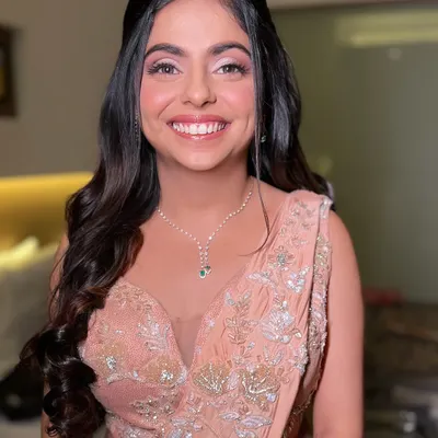 The perfect soft glam look for a reception or engagement party. I gave this beautiful bride a radiant smile with glowing skin, soft pink eyeshadow, and elegant waves in her hair.