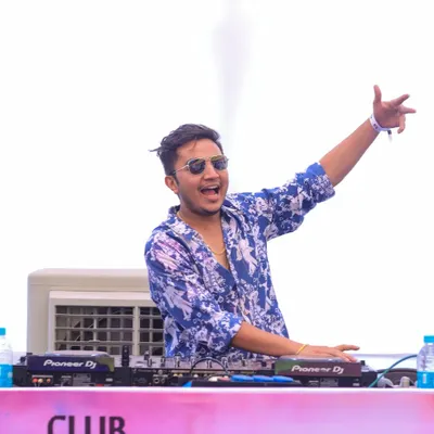A shot of me hyping the massive crowd at a Holi festival. Performing on a big stage for a huge audience is an incredible rush.
