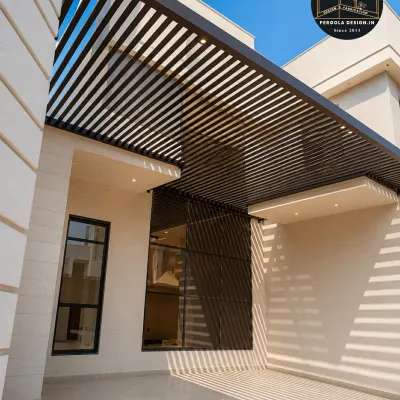 This cantilevered carport features a sleek, louvered design that extends from the home, creating a seamless and modern look. The all-black steel frame provides a bold architectural element while offering effective sun and rain protection for the vehicle parked below.