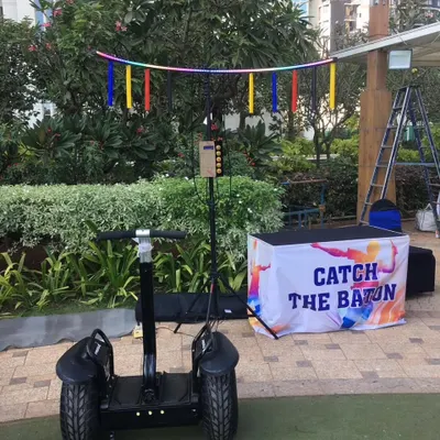 I provide unique entry ideas and fun activities for any event. This setup shows my 'Catch the Baton' game alongside a Segway, a combination that's widely preferred for destination weddings and corporate family days in Lonavala, Pune, and Igatpuri.