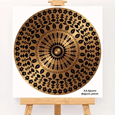 A simple yet elegant mandala created with black and gold colors. This design focuses on clean lines and floral and leaf motifs, offering a sophisticated and modern piece of decor.