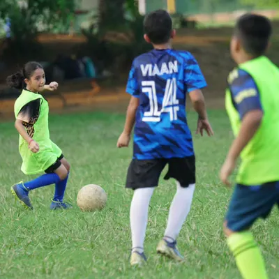 A young lioness focused on the ball during a practice match. We are proud to have girls training and competing alongside the boys.