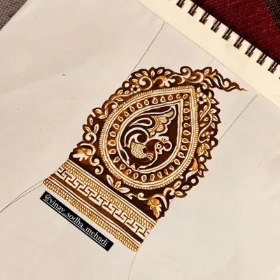 A sketch of a paisley motif with a peacock inside. This is the first step in creating a custom design element for a client.