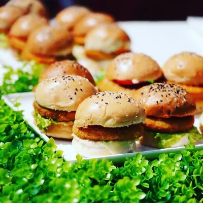 My mini veg sliders are a party in every bite. Served on a bed of fresh greens, these burgers are a healthy and delightful option for guests of all ages.