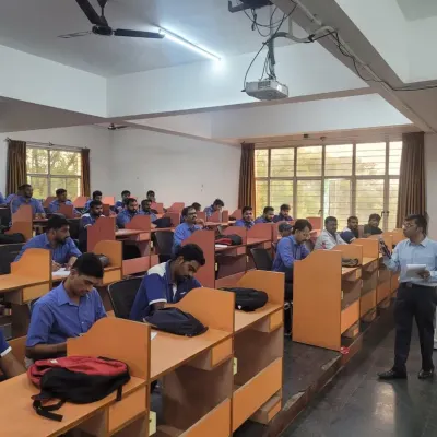 A trainer engages with employees during an English language session at Toyota Kirloskar. Our focus is on interactive learning, ensuring every participant gets an opportunity to speak and practice.