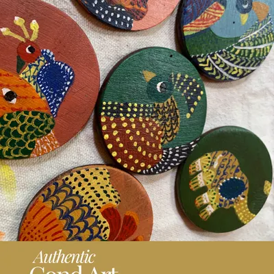 Beautifully painted wooden coasters featuring Gond art birds. This shows how the traditional motifs can be adapted to contemporary objects, a creative exploration we encourage in our classes.