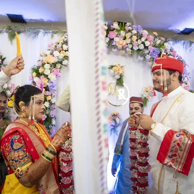 The 'Antarpat' moment, filled with anticipation and emotion, just before the couple sees each other for the first time at the mandap.