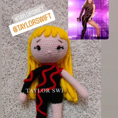A custom order of the singer Taylor Swift in her famous black and red stage outfit. I can make any artist you like.
