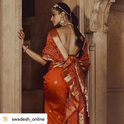 For this high-fashion lookbook, we focused on the exquisite design of the saree and the architectural details of the setting. The composition highlights the garment's drape and the model's elegant posture.