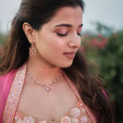 A close-up of Sarah's soft glam makeup. I used hints of pink and soft brown eyeshadow to create a fresh, minimal look that perfectly matched her personality and beautiful pink outfit.