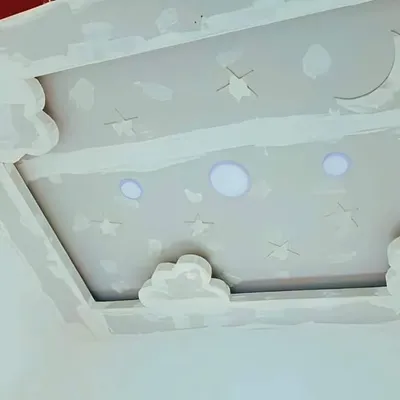An in-progress shot of a dreamy sky-themed false ceiling for a child's room. I created cloud-shaped borders and cutouts for the moon and stars, with openings for integrated lights.