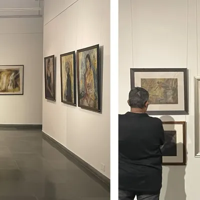 A glimpse into the exhibition 'Vidya Bhushan: Selected Works (1940–1996)'. Visitors are seen contemplating the portraits, showcasing the timeless appeal of Bhushan's art.