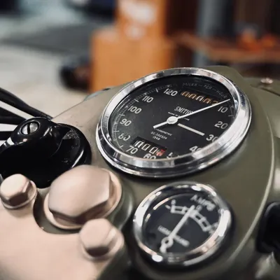 The classic Smiths speedometer and ammeter on the restored 1955 Royal Enfield Bullet, sourced to maintain its original character.