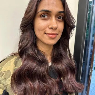 A beautiful blend of wine-colored tones on a dark brown base. These subtle highlights add a rich, crimson glow to the hair, especially when it catches the light.