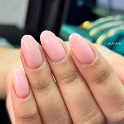 A beautiful, clean set of glossy pink nails for a simple and elegant look.
