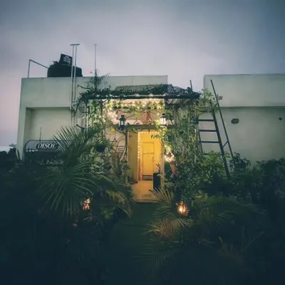 This is my favorite view of the terrace at dusk. The warm glow from the entrance light combined with the string lights makes the entire space feel incredibly inviting and peaceful.