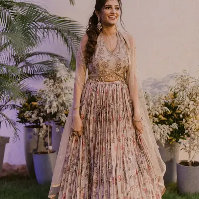 Harini was a dream for her Sangeet. We went with a soft, romantic look with a pop of color on the lips to complement her beautiful floral lehenga.