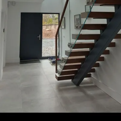 The view from the base of the stairs, showing the powder-coated steel centre spine that provides all the structural support for the treads.