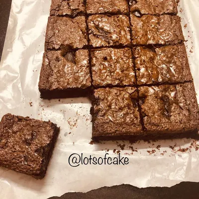 A full tray of my classic chocolate brownies, freshly baked and cut into perfect squares. The happiness I feel when I see that perfect cracked top is something special.