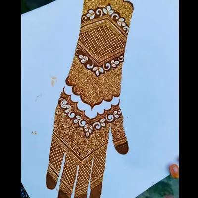 A classic Pakistani bridal design on a practice sheet. This style is known for its heavy, intricate patterns and defined sections, creating a very rich and traditional look.
