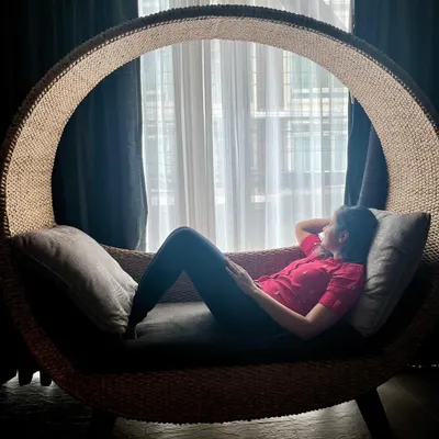 Relaxing in a beautiful, oversized rattan chair during a trip to Thailand. I'm always drawn to furniture made from natural materials like cane and rattan. Their texture and form inspire many of the boho and sustainable decor ideas we explore in my workshops.