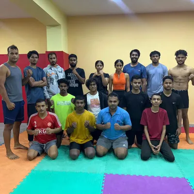 One team, one dream. This group stands together after a demanding session, showing the focus and unity we build in every class.