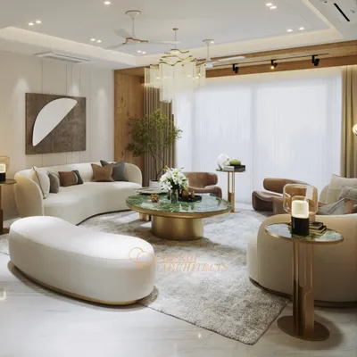 This living space is designed around soft curves and rich textures, with a stunning green marble coffee table as the centerpiece. We used a neutral palette with gold accents to create a room that feels both luxurious and comfortable.