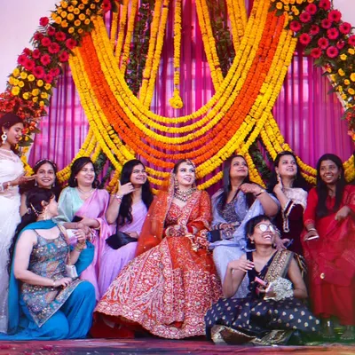 The bride with her bridesmaids. This fun and lively group photo is a must-have for every wedding album, capturing the bond of friendship.